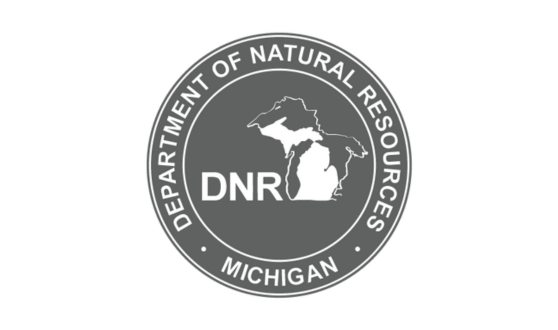 Dark gray circle showing a white image of the state of Michigan and surrounding lakes with text DNR: Department of Natural Resources Michigan