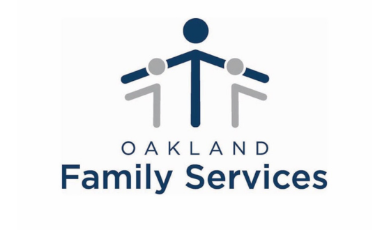 Tall stick figure in blue with a smaller gray stick figure on either side and text Oakland Family Services