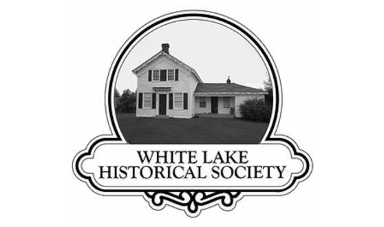 Circular photo of an old farm house and text White Lake Historical Society
