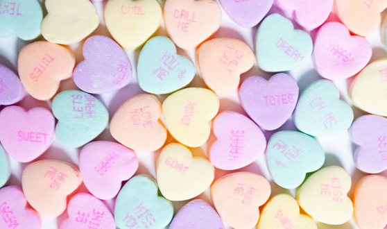 Small colorful candy hearts with sayings printed on them