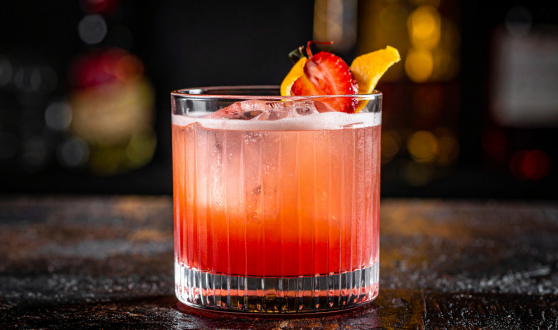 drink in a glass with fruit garnish